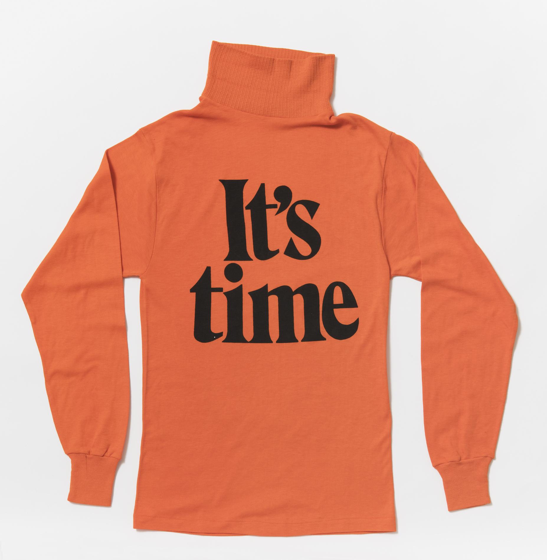 An orange skivvy with the words 'It's time' in big black font on the front.