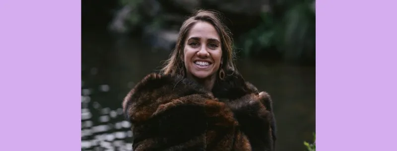 Kirli Saunders standing outside.
